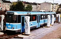 A light-blue tram