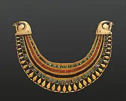 Broad collar of Senebtisi; 1850–1775 BC; faience, gold, carnelian and turquoise; outside diameter: 25 cm, maxim width: 7.5 cm; Metropolitan Museum of Art