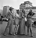 Fashion models in Leipzig, GDR, 1972. One of the girls is modelling a "maxi" dress.