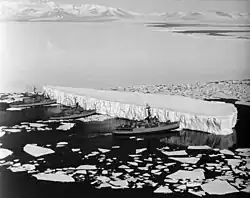 Image 55An iceberg being pushed out of a shipping lane by (L to R) USS Burton Island, USS Atka, and USS Glacier near McMurdo Station, Antarctica, 1965 (from Southern Ocean)