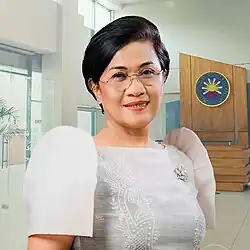 Agrupis in 2025 wearing an embroidered silver terno dress with a silver brooch pin