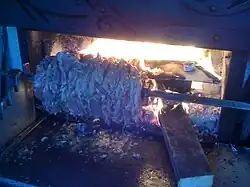 Newly impaled meat cooking on the cağ