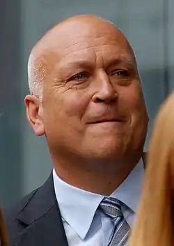 Ripken posing with a figurine