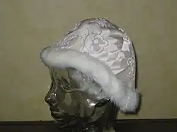 The Easter camauro, with white fur trim and a white damask base.