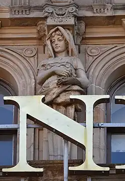 Caryatid (centre), pediment over Bay 4, South Saint David Street façade