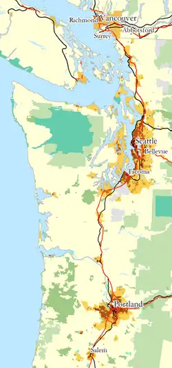Image 33Map of most of the Cascadia urban megaregion, showing population density (shades of yellow/brown), highways (red), and major railways (black). Public land shown in shades of green. This map omits the southern Willamette Valley, which is typically considered part of the megaregion. (from Pacific Northwest)