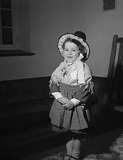 A girl wearing the Traditional Welsh costume for St Davids Day in Barmouth, 1960
