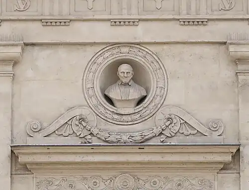 bust of Saint Vincent de Paul over the portal