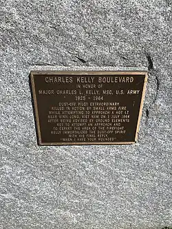 Photo of the Charles Kelly Boulevard commemorative marker at the Fitzsimons Building of the Anschutz Medical Campus.