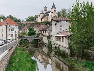 The Pertuis-au-Loup bridge over the River Seine and the church