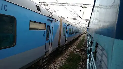 This Shatabdi Express entering Mysuru Junction captured from out going Mysuru–Tuticorin Express