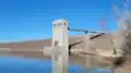 The Cherry Creek Dam outlet manages reservoir levels by releasing water from the reservoir to downstream users.