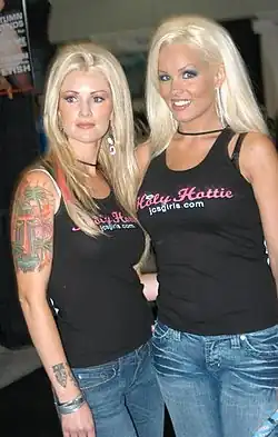 Heather Veitch and another JC's Girls member wearing JC's Girls "Holy Hottie" T-shirts at an erotic convention in Los Angeles in 2006