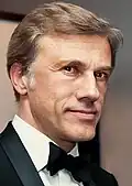 Christoph Waltz wearing a suit and a bowtie in 2012.