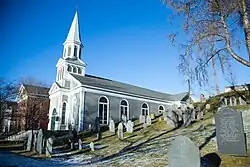 Holy Family Church, and the Old Hill Burying Ground, on Monument Square in Concord