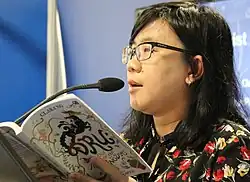 Ng reading her book Dru and Tale of The Five Kingdoms at the 2019 London Book Fair