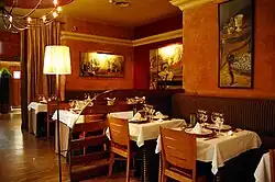 Several tables in the dining area.