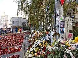 Candles and wreaths at the site of Club Colectiv