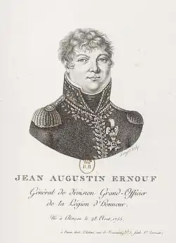 Formal portrait of Ernouf in dress military uniform, wearing a dark coat with shoulder epaulets, a white shirt with a high collar. He has light curly hair and a round face.