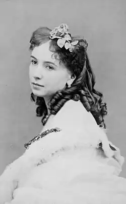 Portrait photograph of a woman in Victorian dress with dark hair