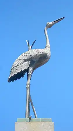 Great Blue Heron atop the fountain