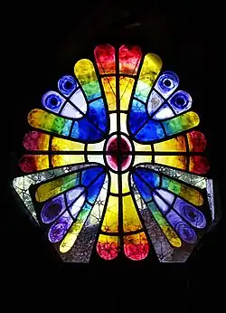Stained glass window with colored glass in the shape of a butterfly wing