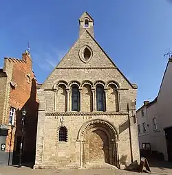 12th century face of the Cromwell Museum from the High Street