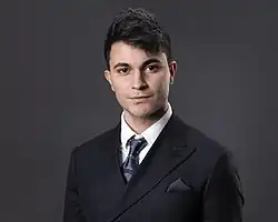 Yousuf wearing a suit