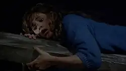 A still of Dana Kimmell acting and performing the barn beam stunt in Friday the 13th Part III (1982)