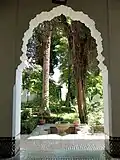 View of the fountain and trees in the courtyard garden of the palace