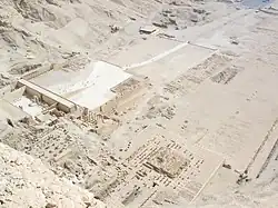 The three temples at Deir el Bahari from the top of the cliff behind them, part of Hatshepsut's temple on left, Tuthmosis III's temple in center, and Mentuhotep II's temple on right