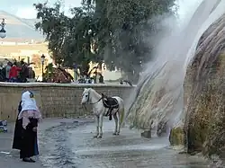 People beneath the cascade