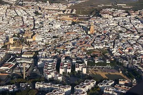 Aerial view of the old town of Utrera, with residential buildings, churches and parks