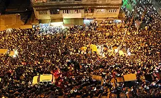People outside Hazarika's home on 7 November 2011