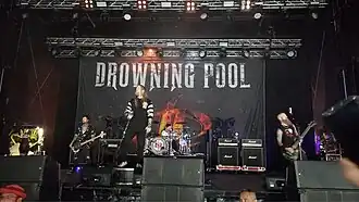 Drowning Pool performing in 2025