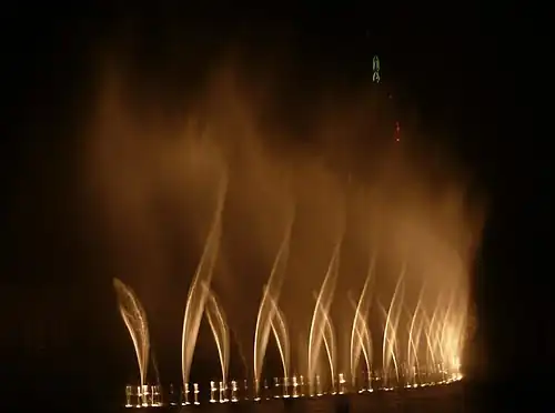 Dubai Fountain (2008), a computer-programmed musical fountain, is 250&nbsp;m (820&nbsp;ft) long and can jet water 150&nbsp;m (490&nbsp;ft) into the air
