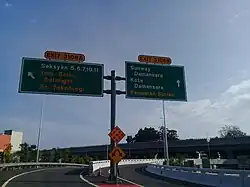 Road junction sign at Surian Interchange.