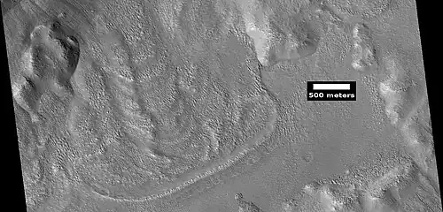 Glacier coming out of valley, as seen by HiRISE under HiWish program Location is rim of Moreux Crater. Location is Ismenius Lacus quadrangle.