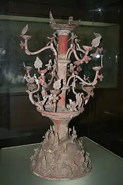 An Eastern Han ceramic candle-holder with animal figurines