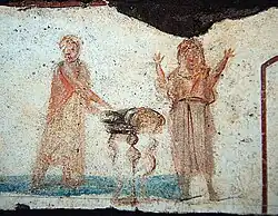 catacomb art of woman with raised hands and man celebrating eucharist