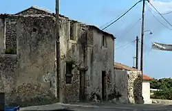 An image of an Alley in Exo Chora with buildings a little run down