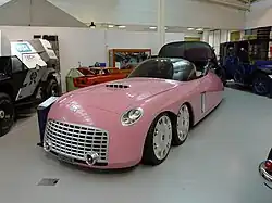 A streamlined six-wheeled car