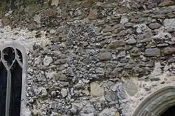 Blocked Anglo-Saxon round-arched window at St Michael's Church in Fobbing, Essex
