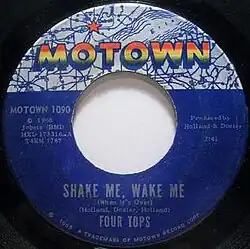 A blue vinyl record of the single appears