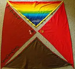 Four Scout scarves (clockwise from top) the 21st World Scout Jamboree scarf, a Gang Show scarf from Cumberland Gang Show, the troop and group scarf from 1st Cherrybrook Scout Group, and the national scarf for Australia