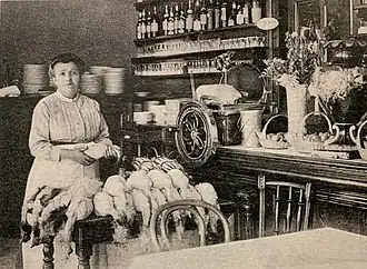 Woman with chickens in a kitchen