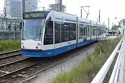 Combino tram at Amsterdam Zuid station. Note that this photo was taken when trams still had their stop inside the station, rather than the current two stops just outside.