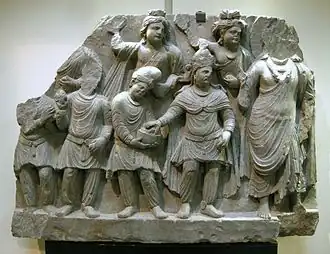 Kushan prince, said to be Huvishka, making a donation to a bodhisattva.[66]