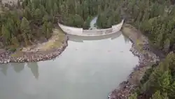 Drone image of Gerber Reservoir dam taken looking SW from the reservoir toward the dam.