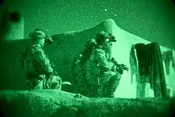 Coalition security force members provide security during an operation in March 2013.